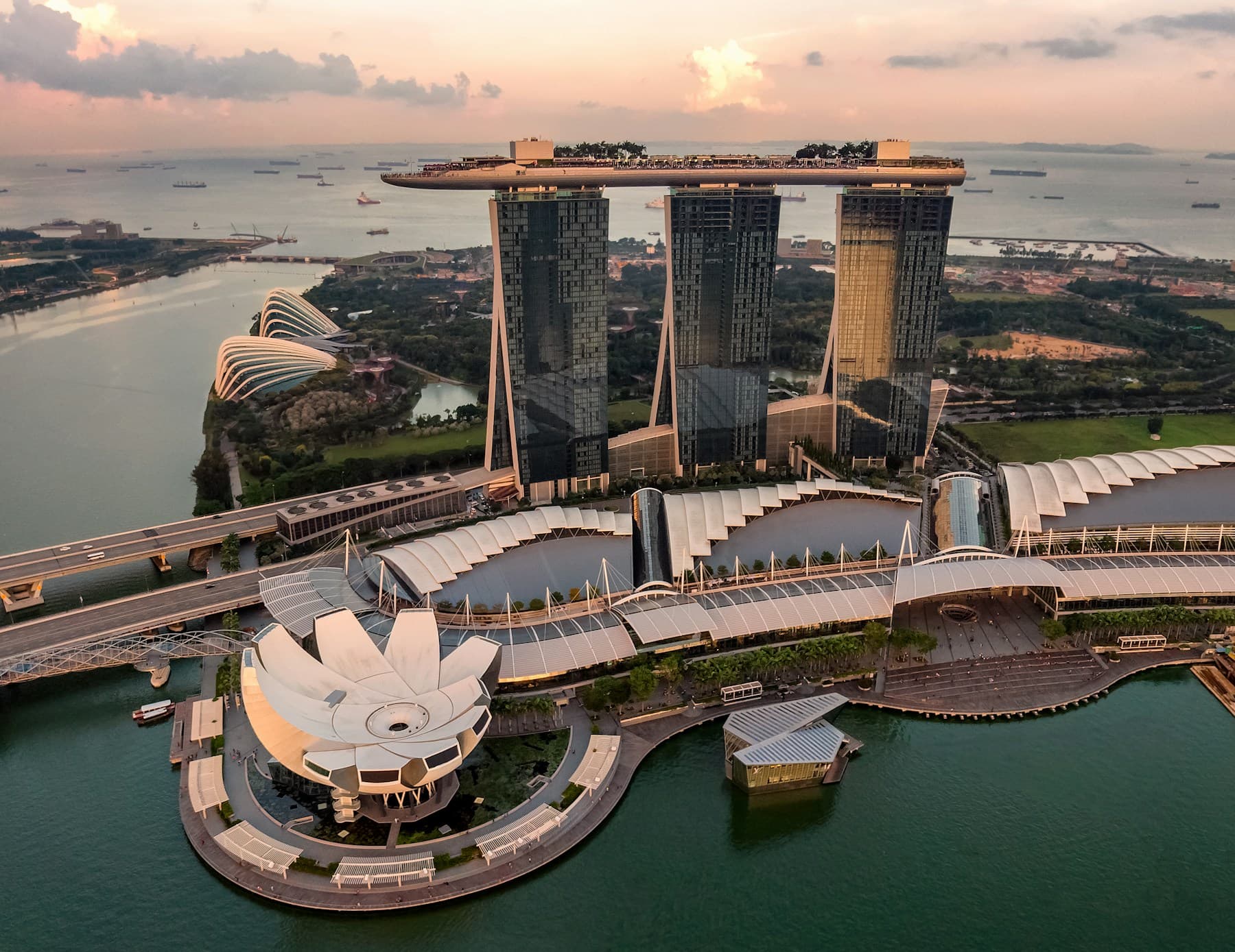 Marina Bay waterfront and Singapore Strait at sunset